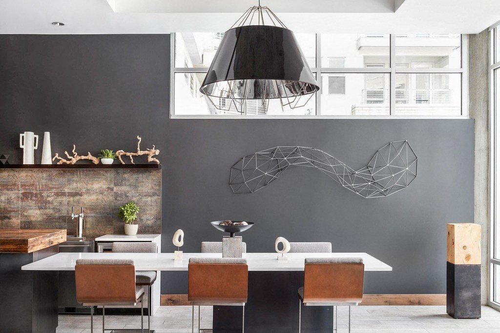 Clubhouse with Long Table with Contemporary Chairs, Contemporary Art and Light Fixture