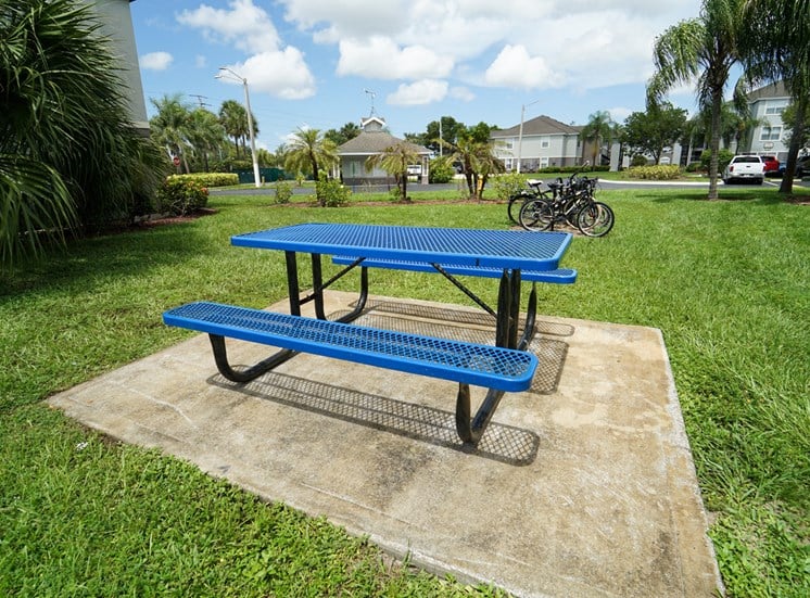 Outdoor picnic area surrounded by native landscaping