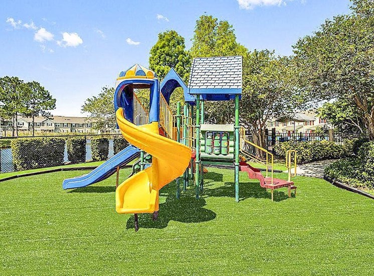 Playground with a yellow and blue slide.