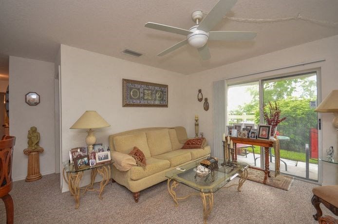 Decorated Living Room With Natural Light at River Park Place Apartments, Florida