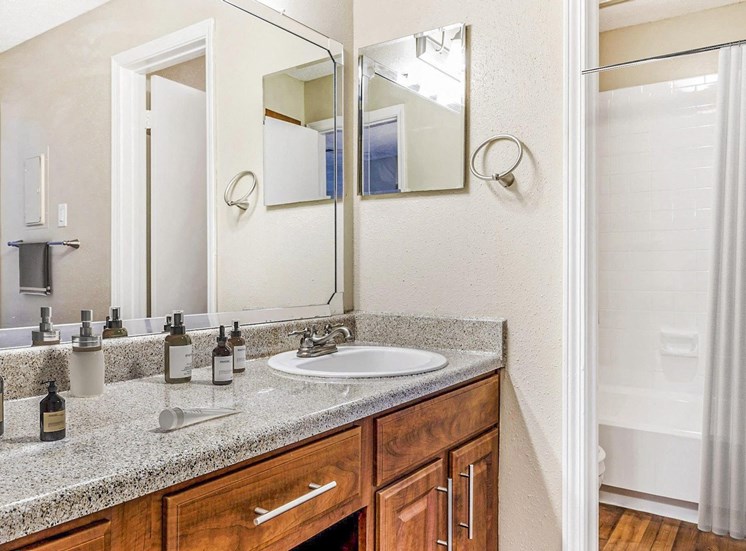 Bathroom with mirror above sink