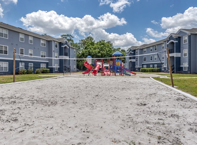 Outdoor sand volleyball court and playground