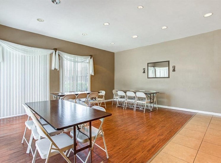 Clubhouse with table and chairs on hardwood style flooring