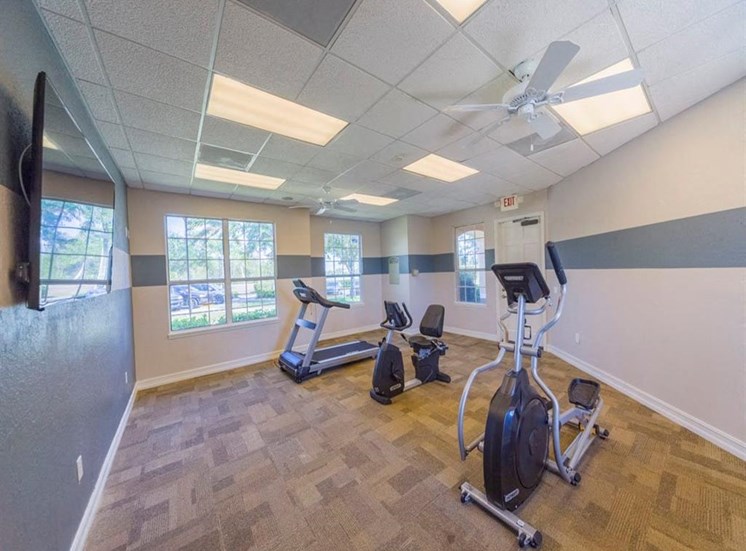 Fitness Center with Exercise Equipment and a Ceiling Fan