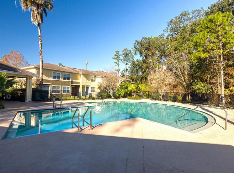 Swimming Pool With Lounge Seating at Holly Cove Apartments, Orange Park, Florida