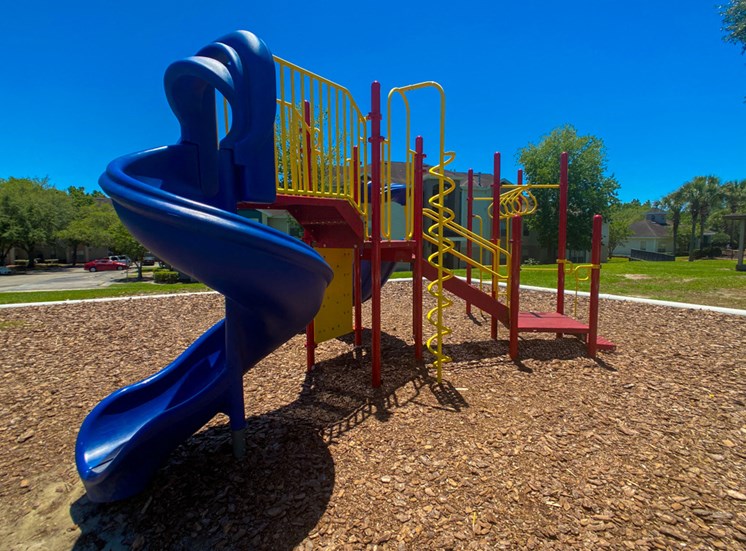 Outdoor Playground equipped with a slide, monkey bars, and latter
