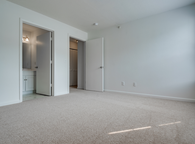 The master bedroom has wall to wall carpet, direct access to the bathroom and a large walk in closet.