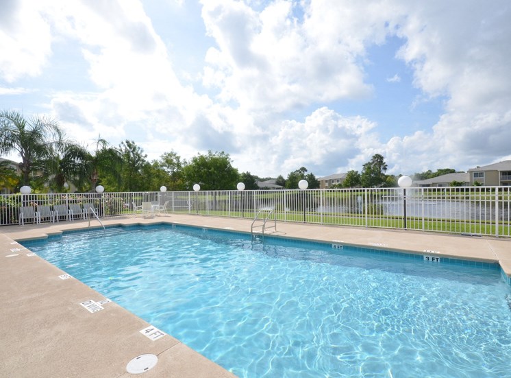 Swimming Pool And Relaxing Area at River Park Place Apartments, Florida
