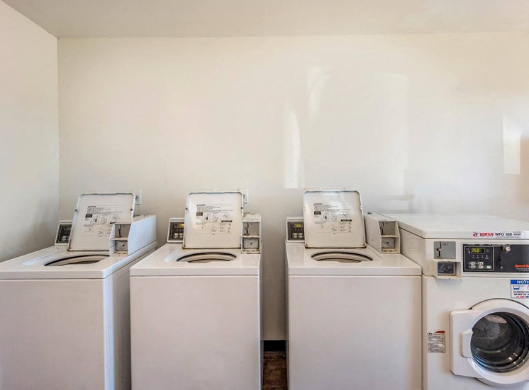 White Washing Machines and Dryer Against Wall
