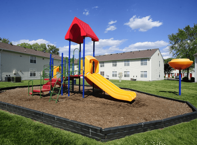 Outdoor playground with slides, latter, and monkey bars