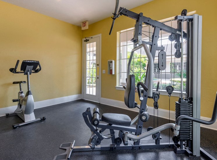 Bright Fitness Center with Exercise Equipment  and Large Windows