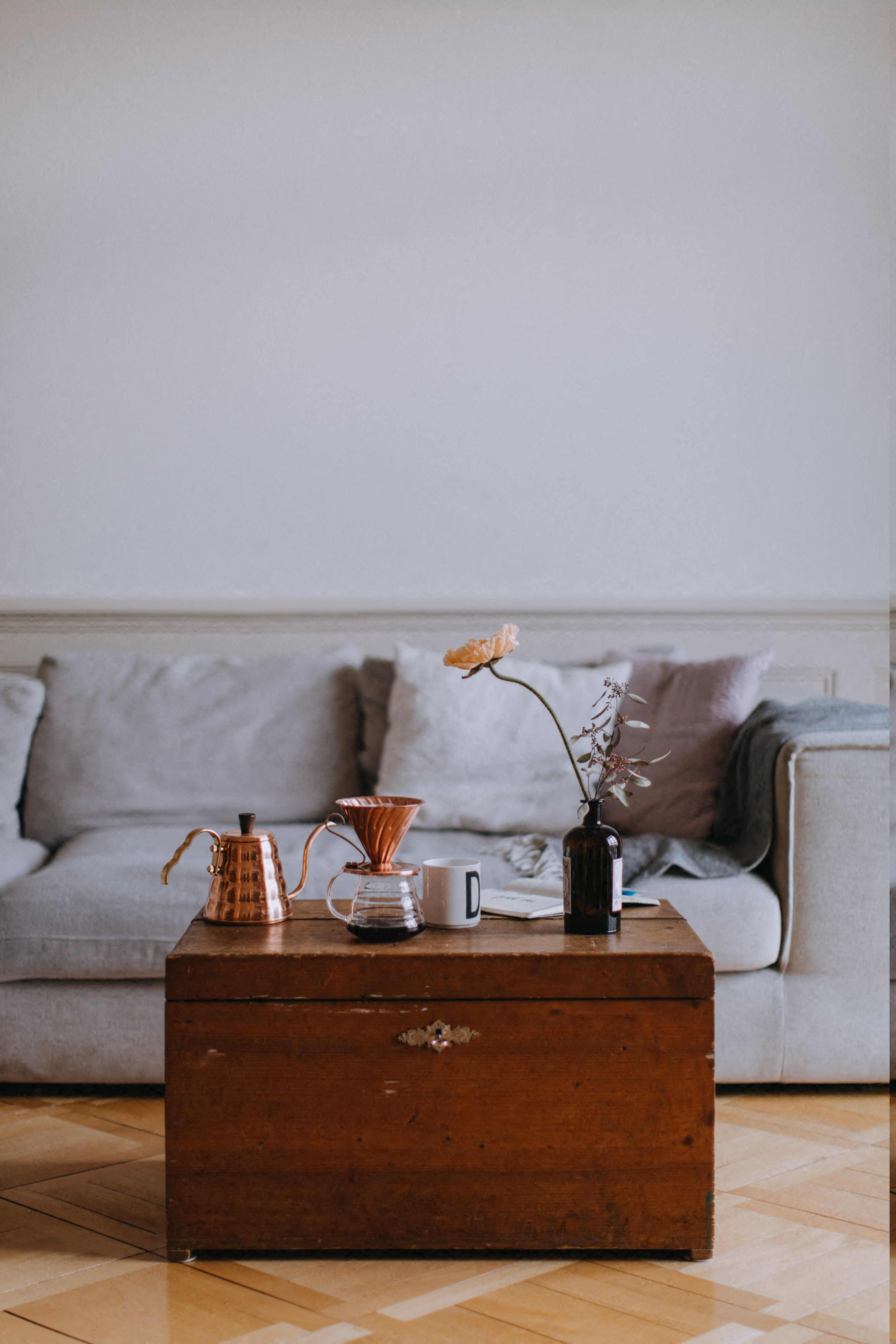Stock Image of Living Room with Wood Coffee Table and Grey Couch