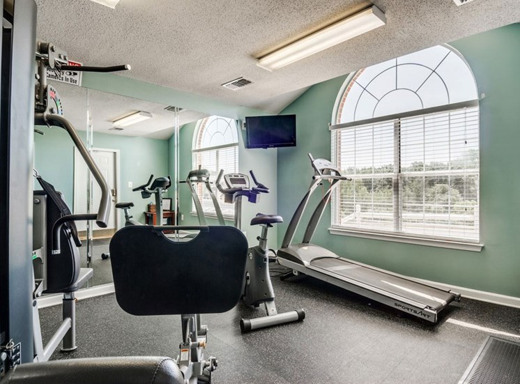 Bright Fitness Center with Windows and Exercise Equipment