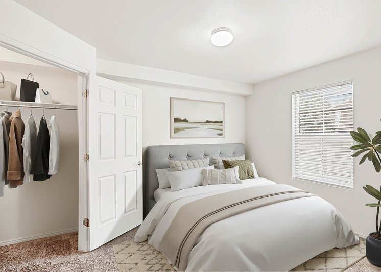 Bedroom with large bed and décor with view of  walk-in closet