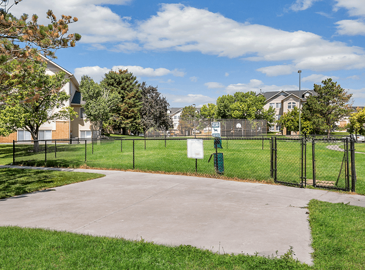 Dog park with gated green grass area