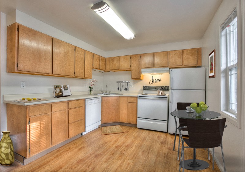 Village on Leisure interior kitchen with white and wood cabinetry