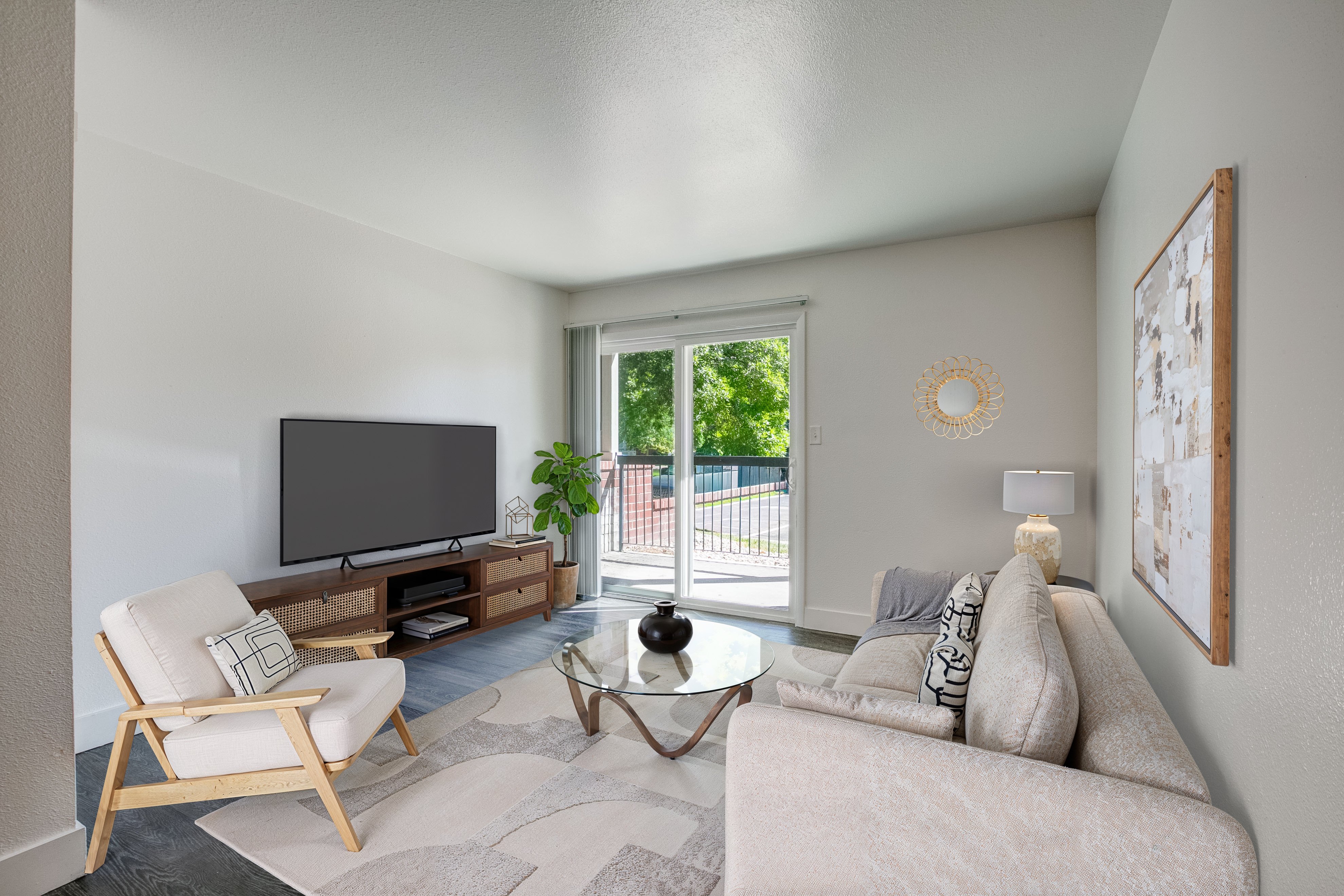 A living room with a couch, chair, and television.,A living room with a couch, chair, and television.