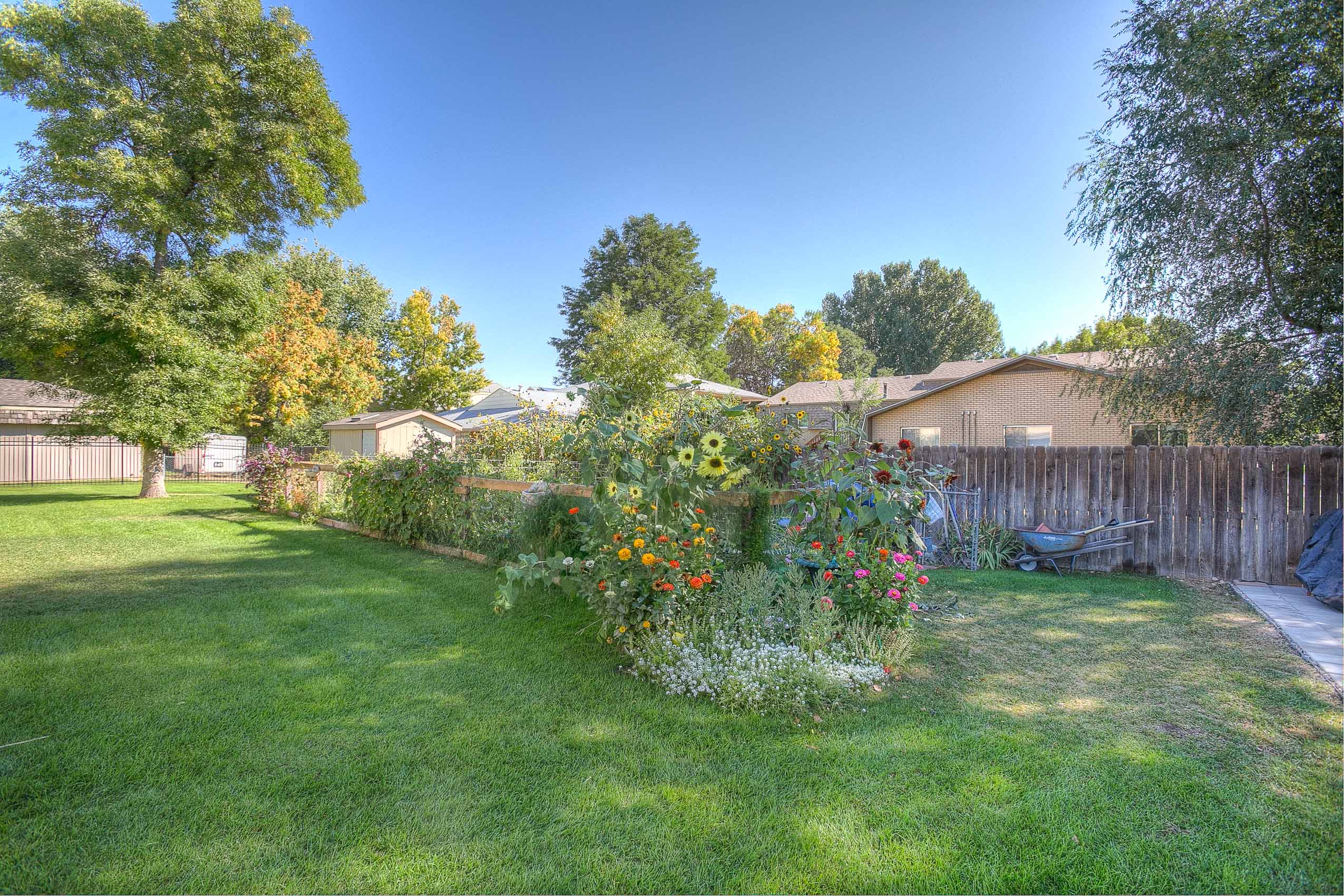 Village on Leisure exterior featuring flowers and greenery