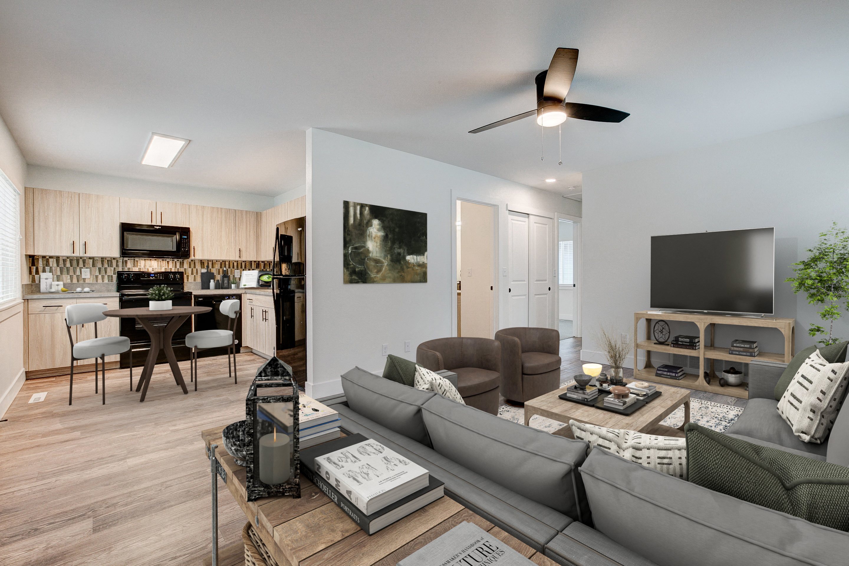 A living room with a grey couch and a coffee table.