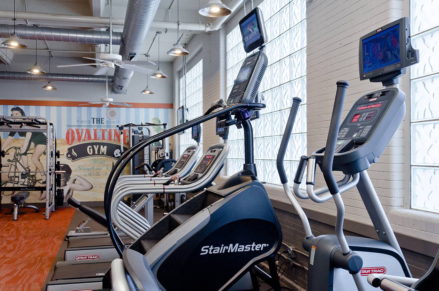 cardio machines in the fitness center at Ovaltine Court Apartments