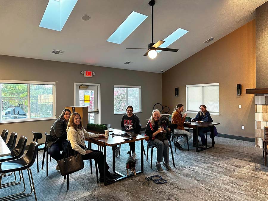 Residents gathered around tables at The Northbrook Apartments clubhouse for an event