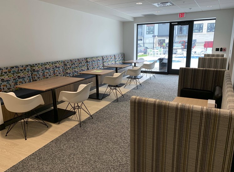 Interior space near the door to the pool with work from home tables and seating