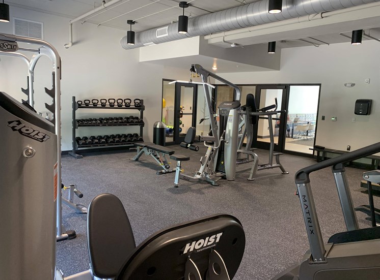 Fitness center with strength training and cardio equipment at Haven at Uptown