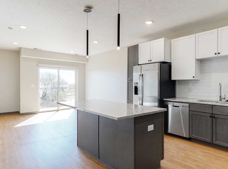Open concept kitchen and living space in the Bliss floor plan at Haven at Uptown in Lincoln, NE