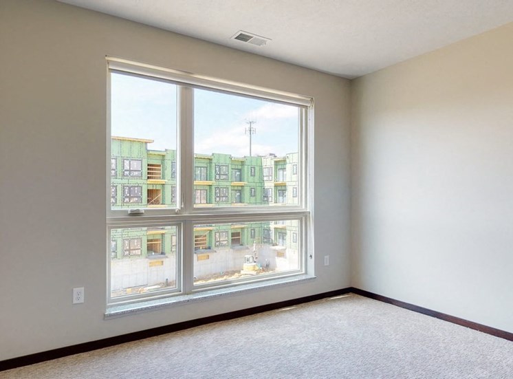 Natural light in bedroom provided by large windows at Haven at Uptown in Lincoln, NE