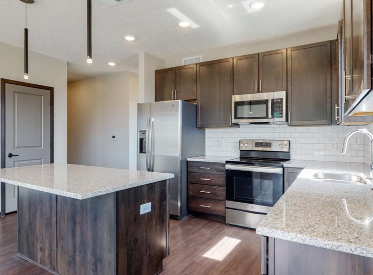 View of mocha style finishes in Shine floor plan kitchen at Haven at Uptown in Lincoln, NE
