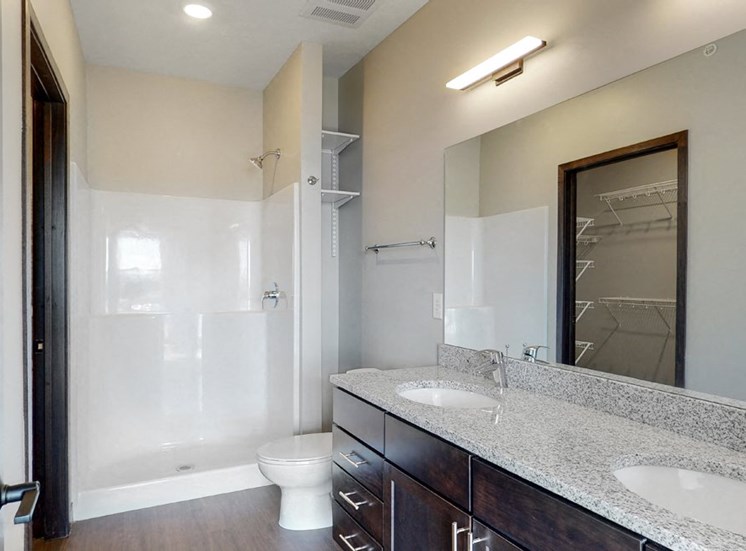 Large master bathroom with dual sink counters at Haven at Uptown in Lincoln, NE