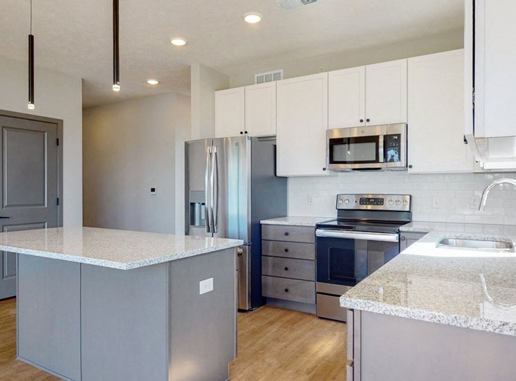 Two tone slate finishes in the Shine floor plan kitchen at Haven at Uptown in Lincoln, NE