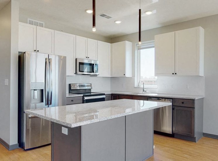 Kitchen and island seating with the slate finish style in the Shine floor plan at Haven at Uptown in Lincoln, NE