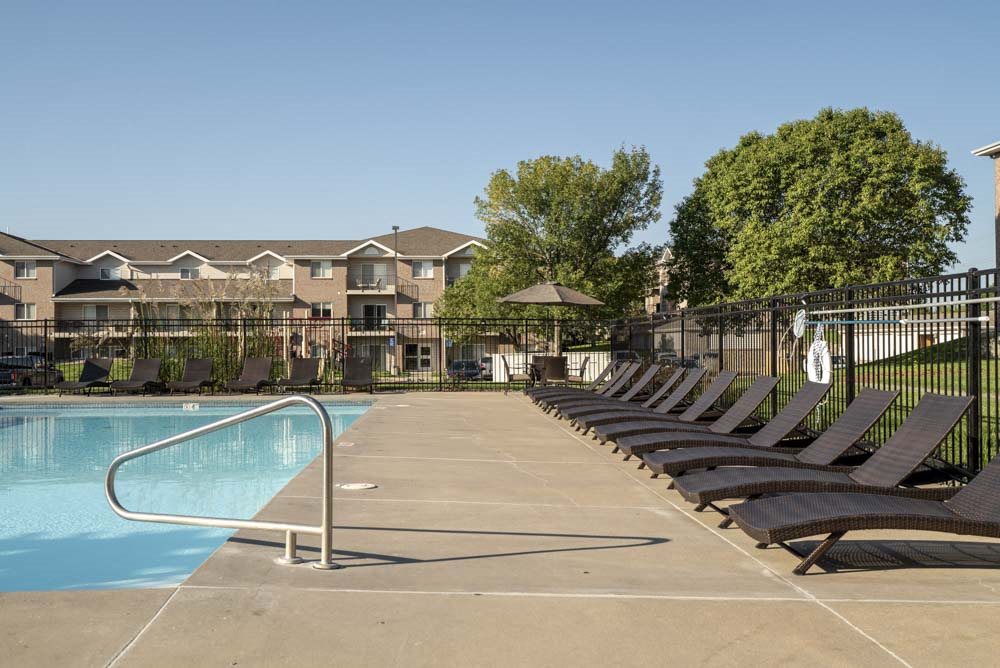 Pool with lounge chairs at Highland View Apartments in north Lincoln NE 68521