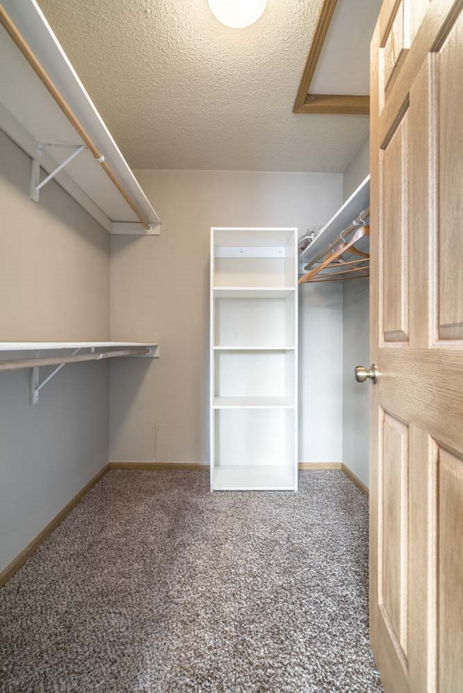 Large walk-in closet with shelving at Southwind Villas in southwest Omaha in La Vista, NE, 68128