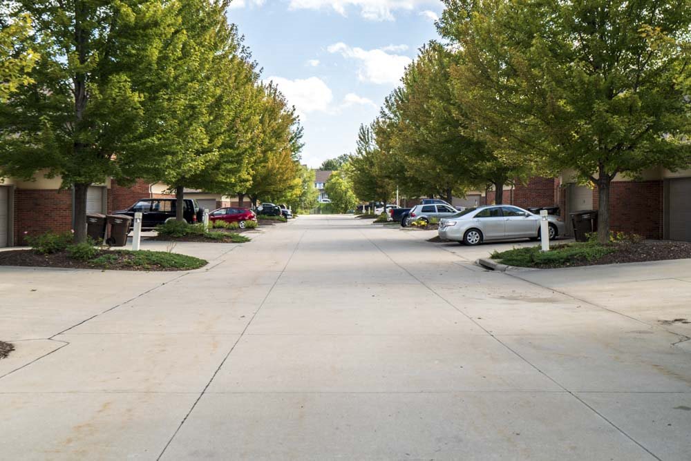 Wide neighborhood streets lined with mature trees  at Southwind Villas in southwest Omaha in La Vista, NE, 68128