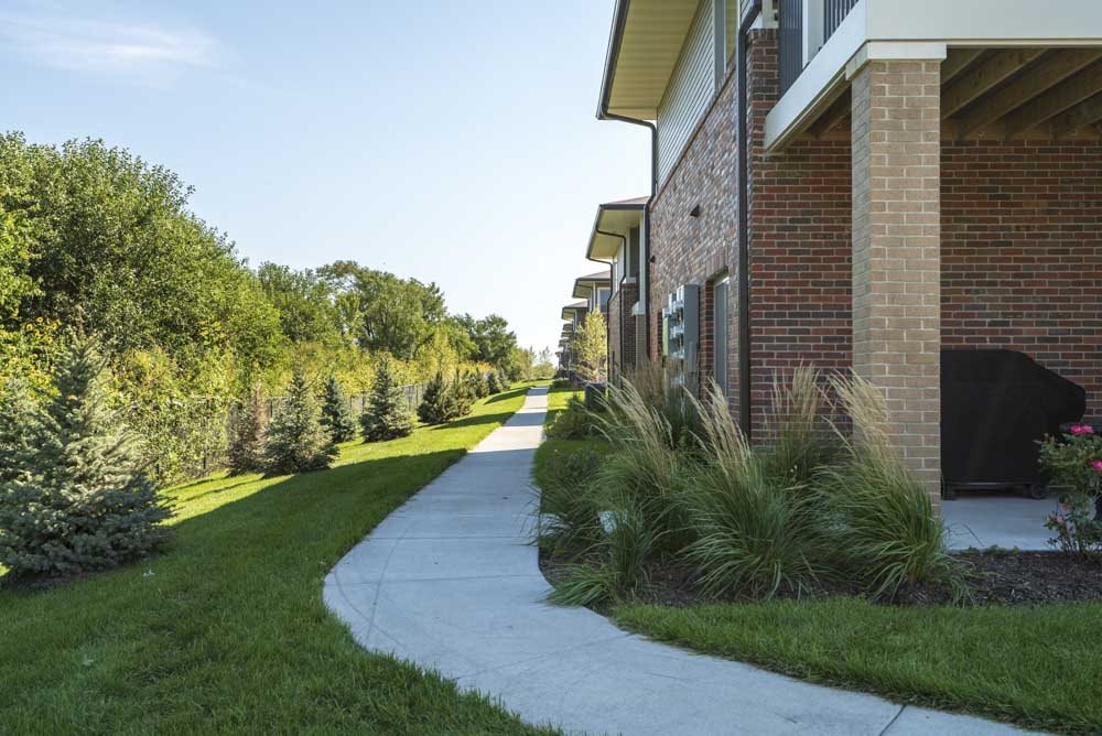 Walking paths leading to the buildings at The Villas at Mahoney Park
