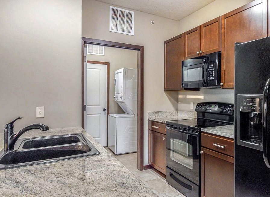 A separate laundry room is located right off the kitchen in the 2 bedroom Ash at The Villas at Wilderness Ridge in southwest Lincoln NE 68512