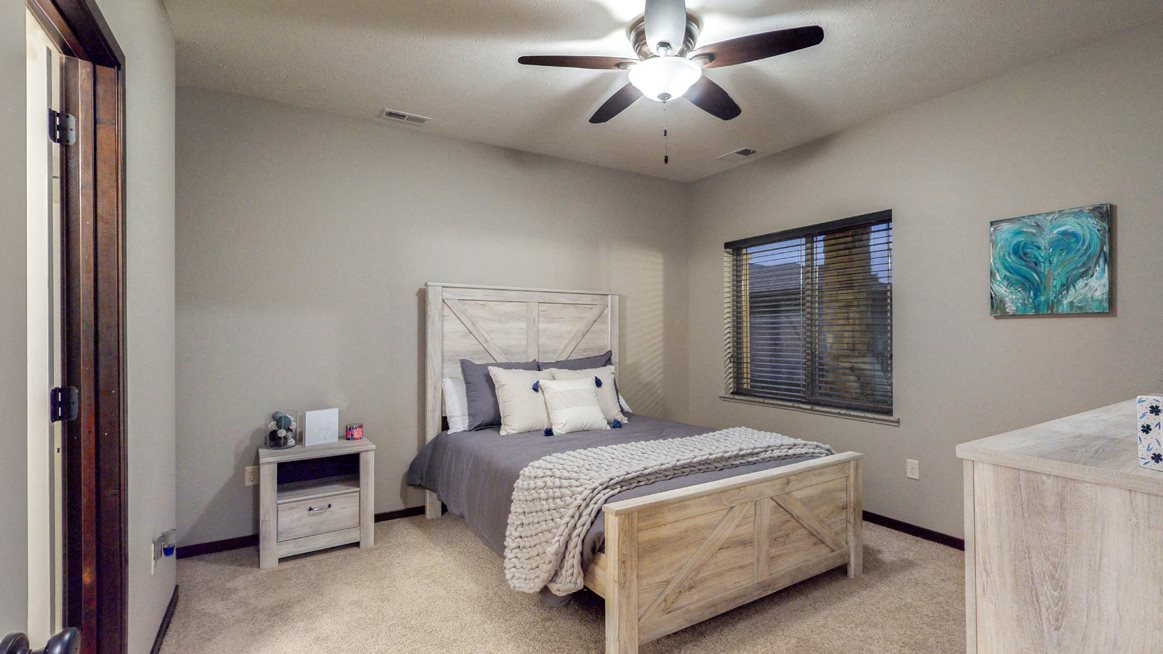 Spacious bedrooms and ample closet spaces are found in the Cedar floor plan
