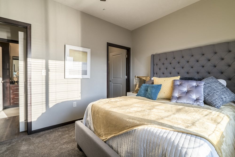 Spacious bedroom large enough to include a king sized bed at The Villas at Mahoney Park