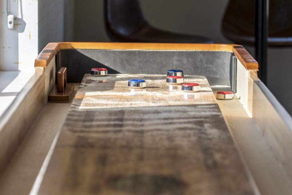 Shuffle board table in the clubhouse at The Villas at Mahoney Park