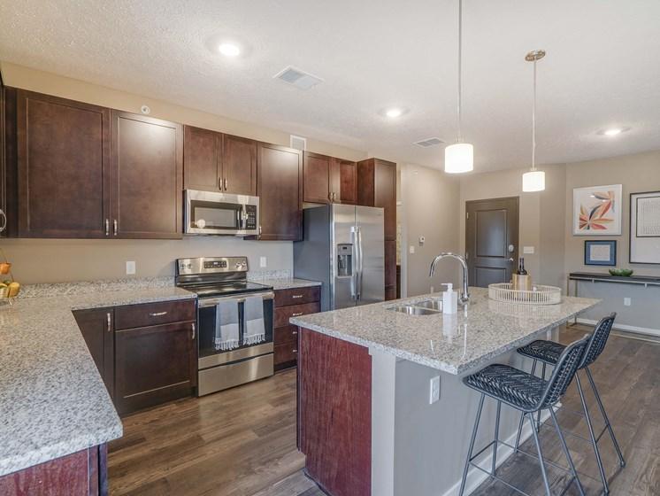 Spacious kitchens with granite countertops at The Flats at Shadow Creek new luxury apartments in east Lincoln NE 68520
