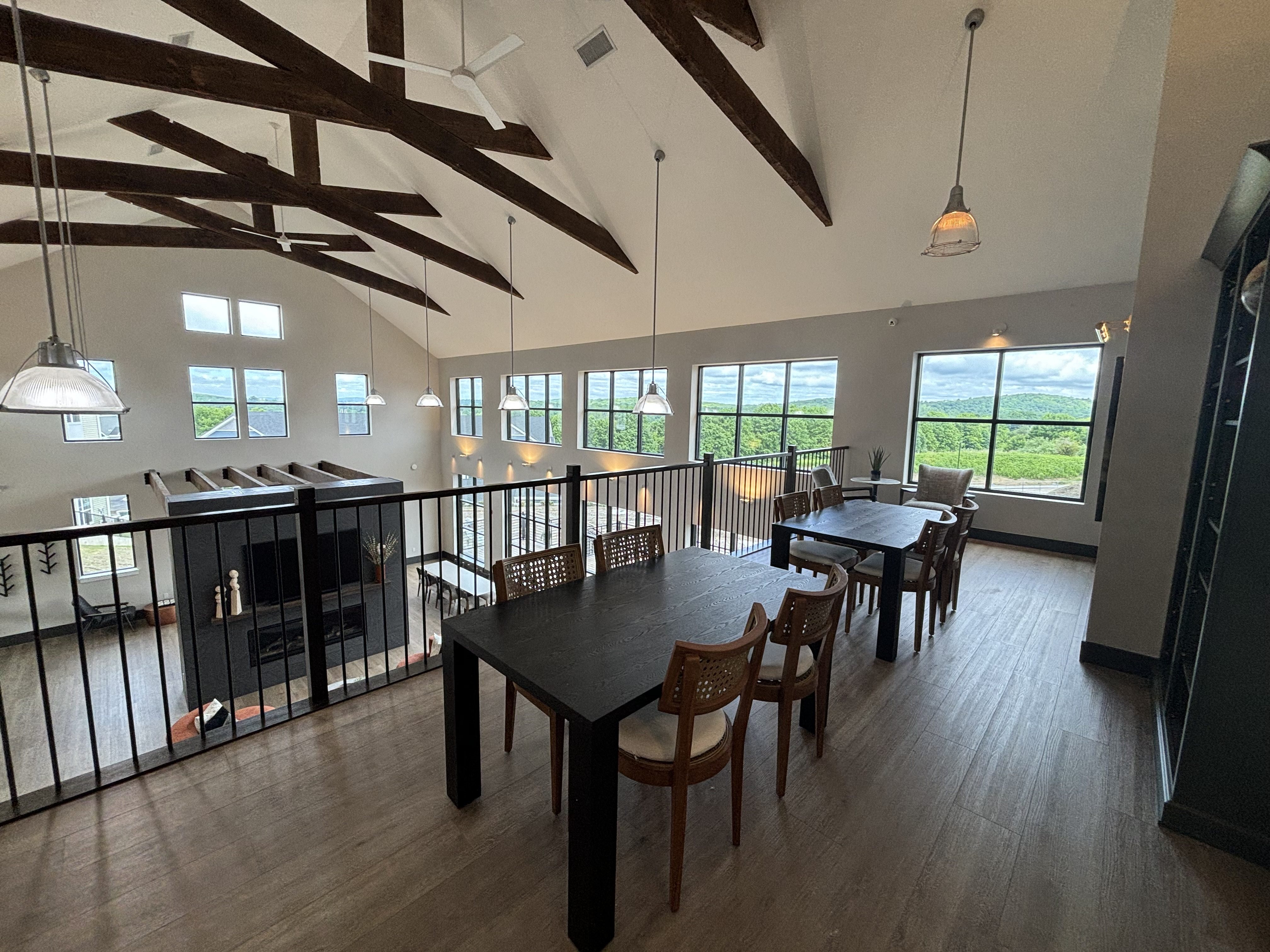 a view of the dining room and living room from the balcony