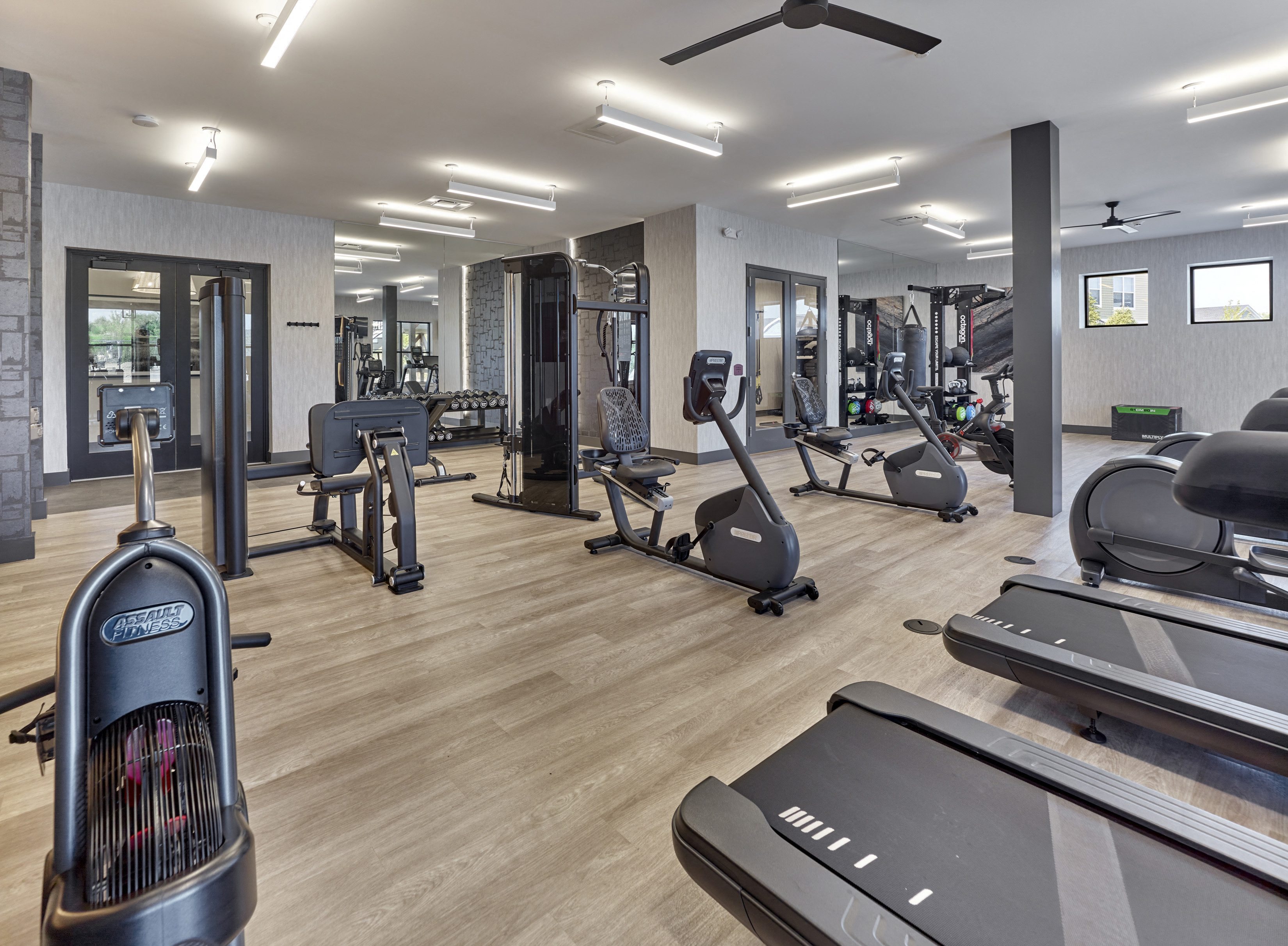 a gym with treadmills and other exercise equipment