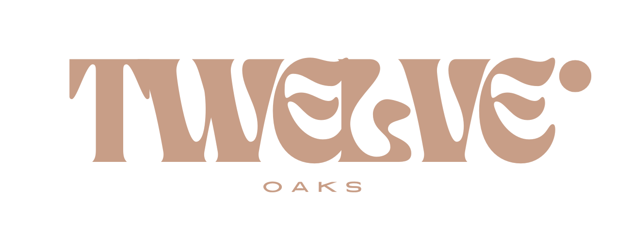 a logo that reads weaved oaks on a black and pink background