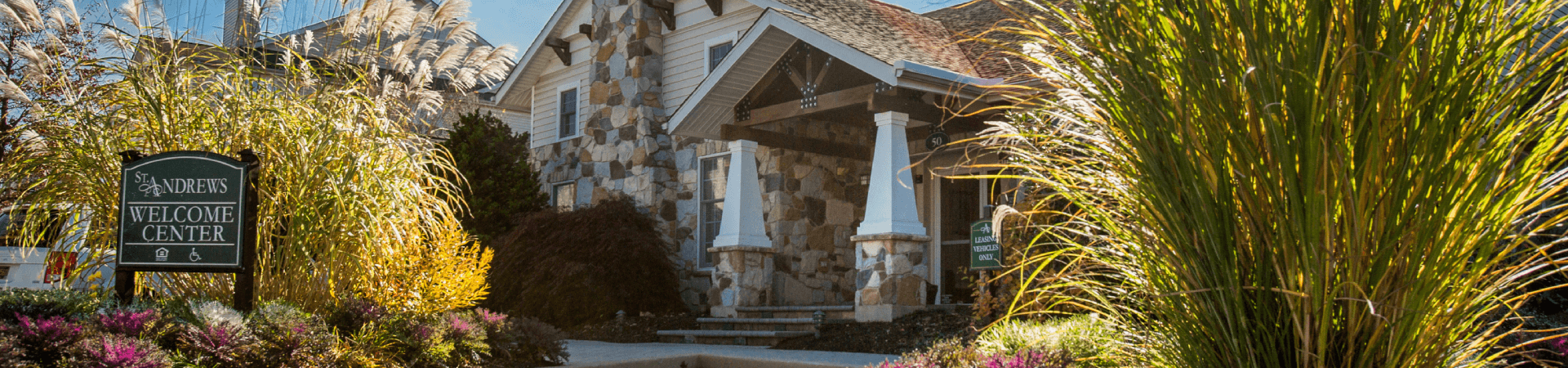 A stone building with a sign that says "Andrews Welcome Center".