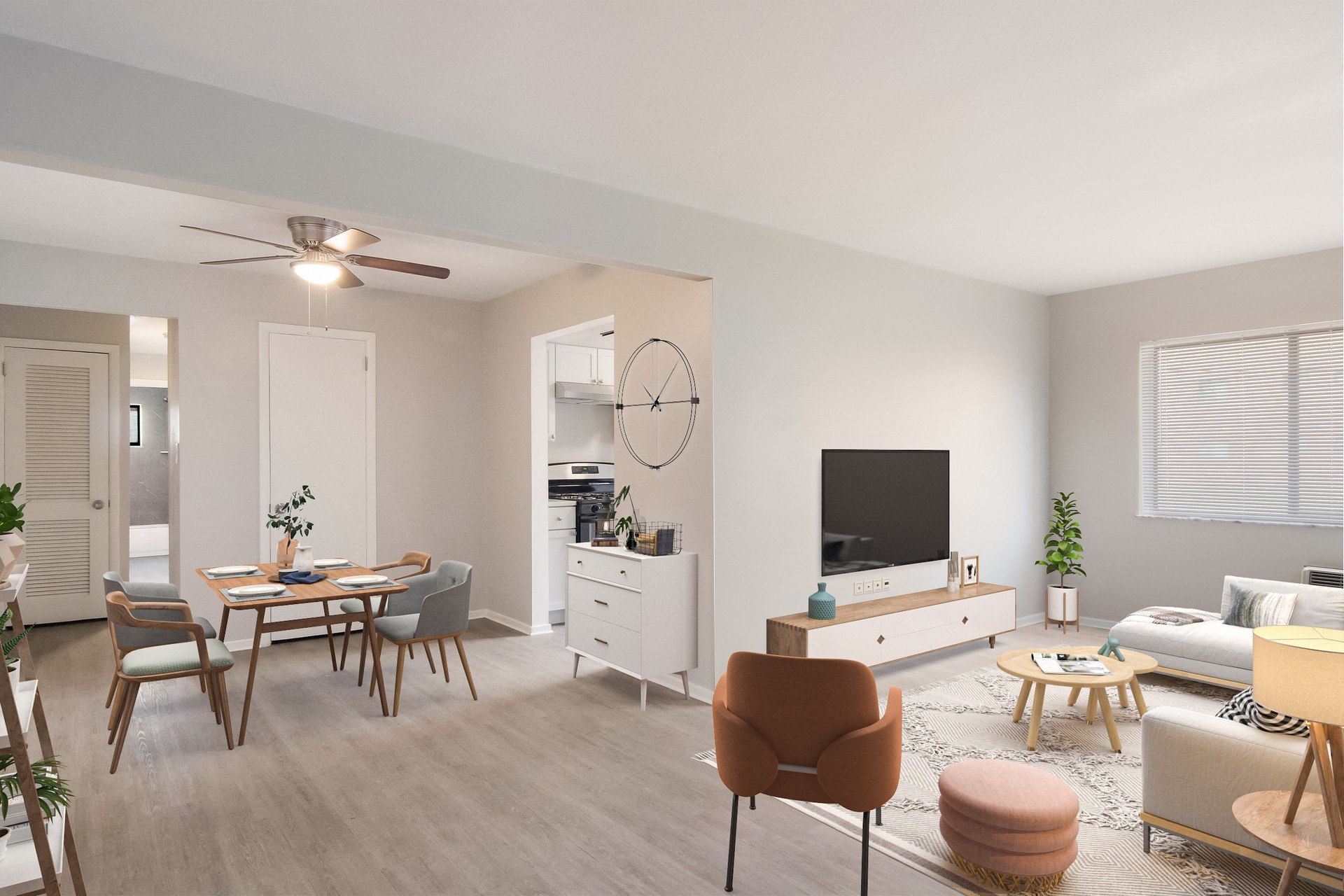 a living room and dining room with a large clock on the wall at Bedford Castle, Bedford Heights, 44146