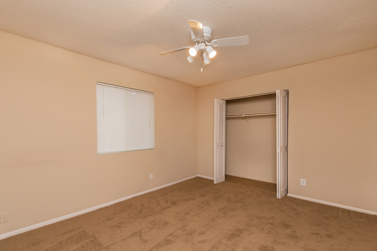 Wooden flooring bedroom with ceiling fan at Preston Court Apartments, Kansas, 66212