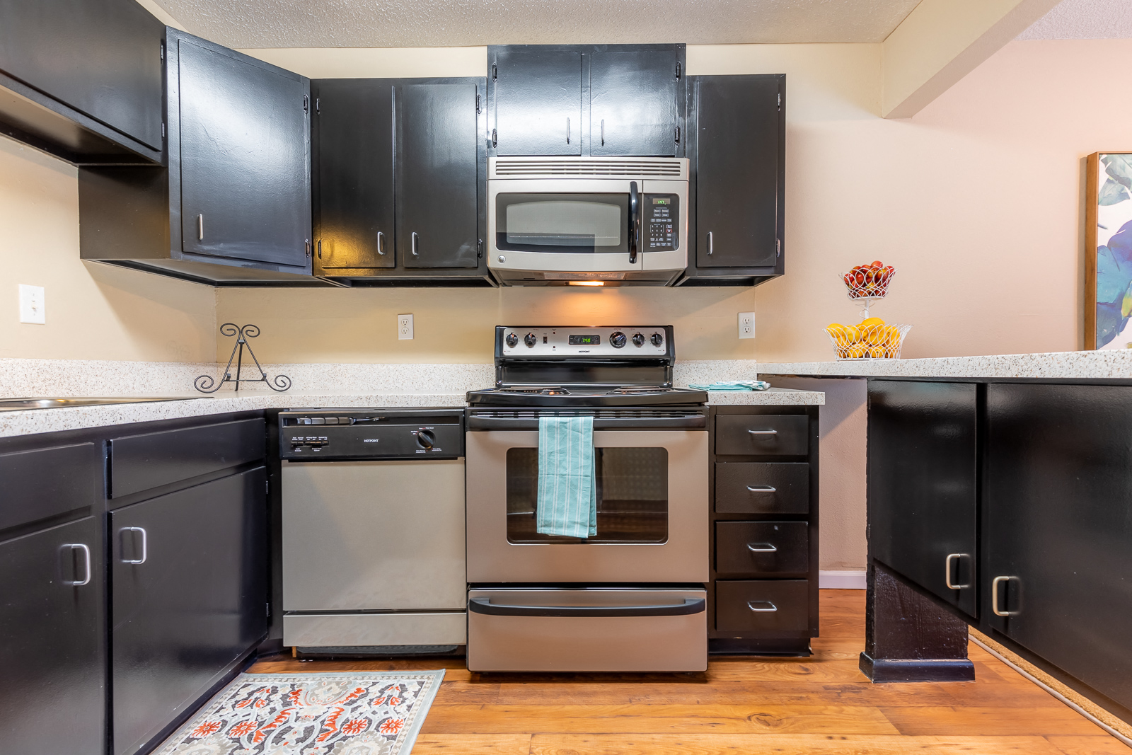 Kitchen with appliances and cabinetsat Preston Court Apartments, Kansas, 66212
