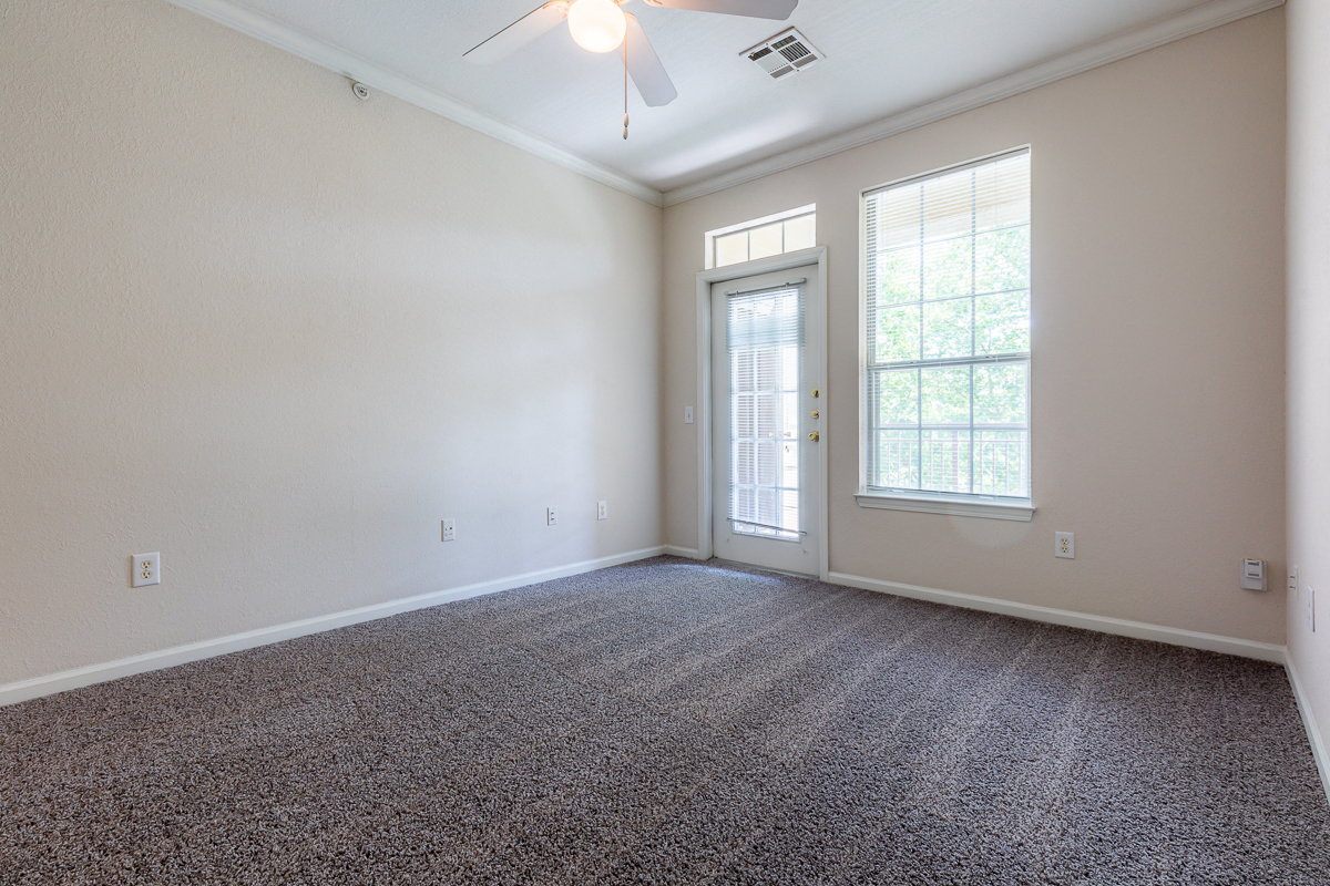 Carpeted Bedroom at Crowne Chase Apartment Homes, Overland Park
